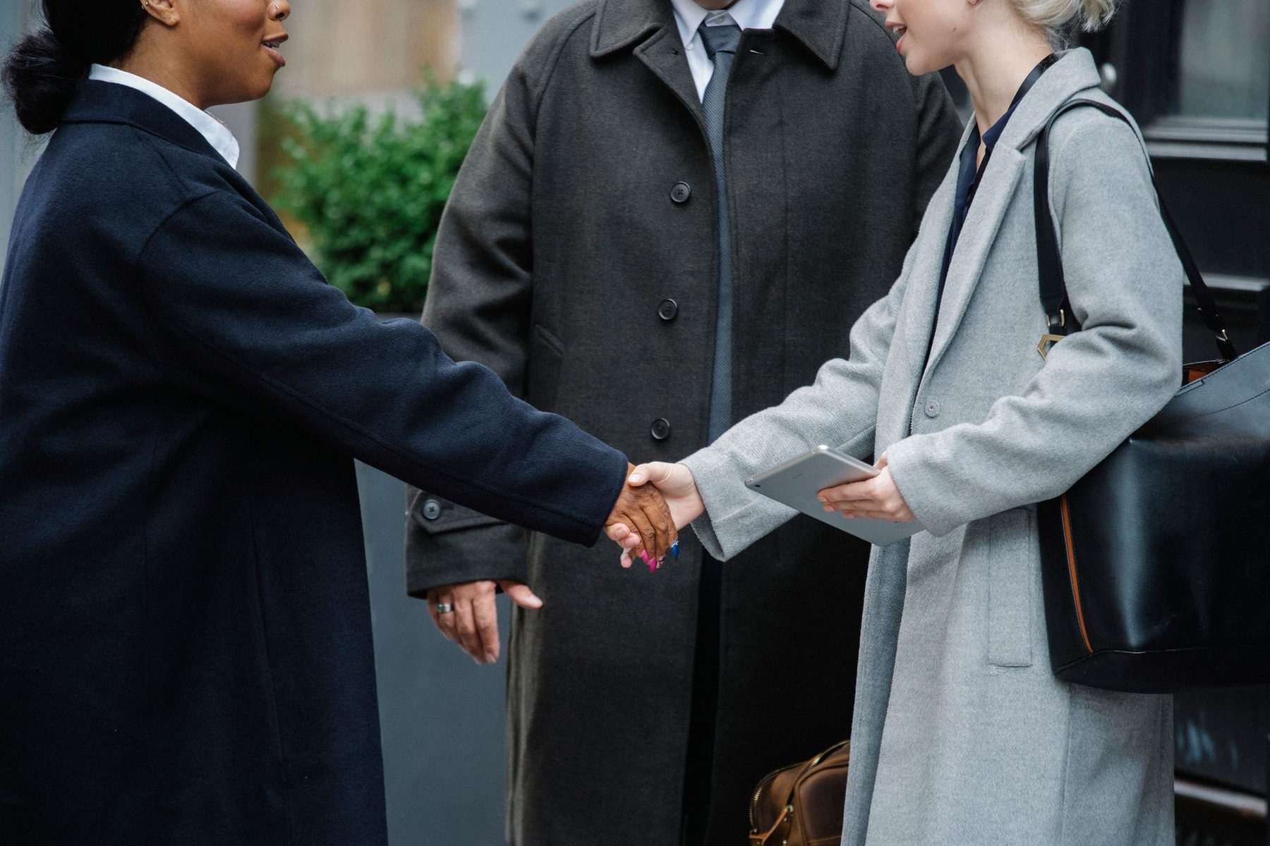 Business handshake concluding a funding agreement