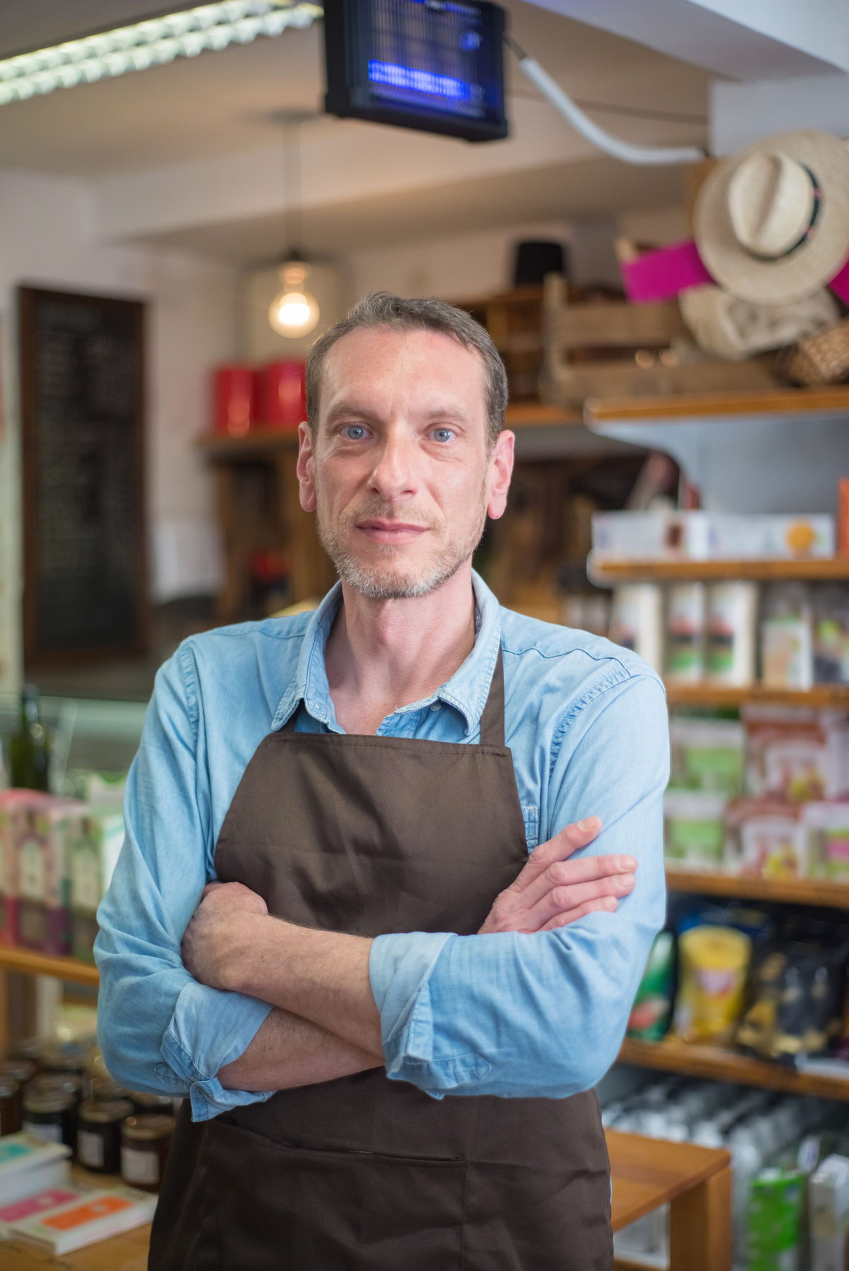 Small-business owner standing confidently in their own premises